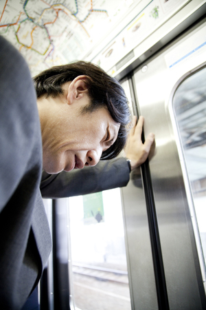 Businessman take a hand in the doorの写真素材