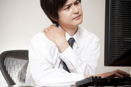 Business people packed in front of the PCの写真素材