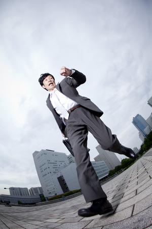 Businessman to run while watching the watchの写真素材