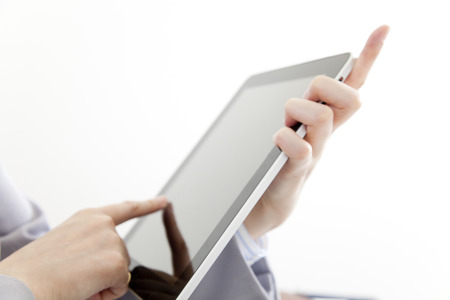 Hand of OL to operate the tablet PCの写真素材