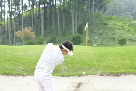 Men hit the bunker shotの写真素材