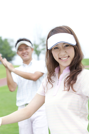 Men to clap and smile womanの写真素材