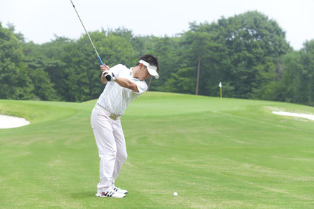 Men hit the approach shotの写真素材