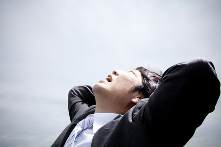 Businessman to seek the heavensの写真素材