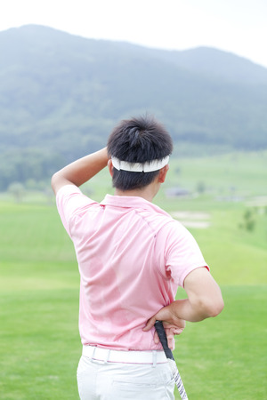 Man overlooking the courseの写真素材