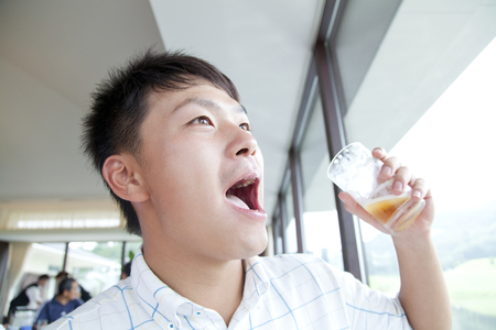 Men drink beerの写真素材