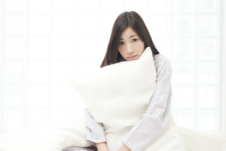 Women who feel the pillowの写真素材