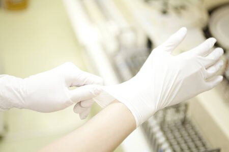 Hand of nurse Fit the rubber glovesの写真素材