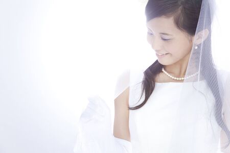 Bride touching the veilの写真素材