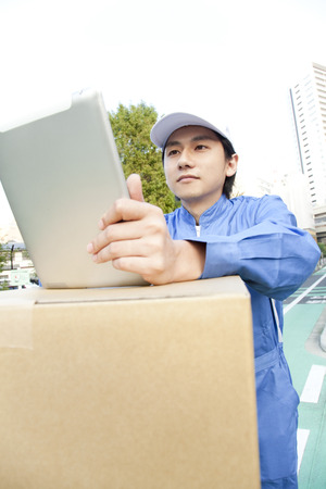 Movers with a tablet PCの写真素材