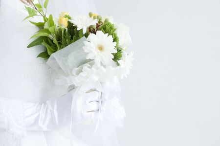 Hand of the bride with bouquetの写真素材