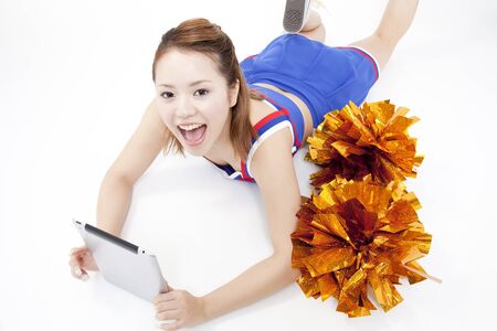 Cheerleader with a Tablet PCの写真素材