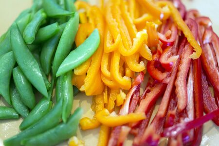 Cut the green and yellow vegetablesの写真素材