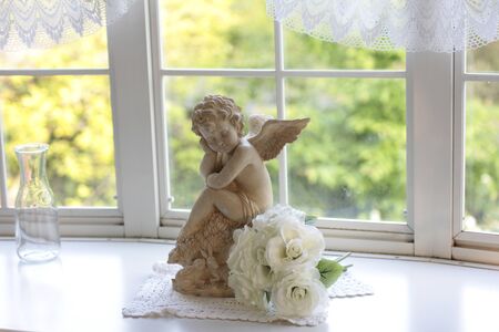 Windowsill of angelの写真素材