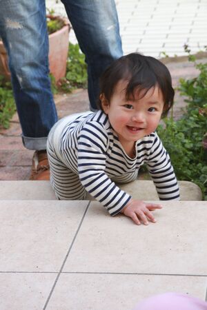 Children playing on the terraceの写真素材