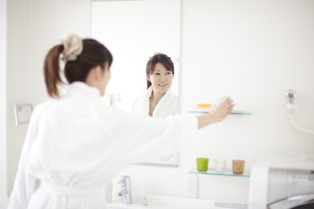 Women look in mirrorの写真素材