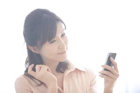 Women see the Smartphoneの写真素材