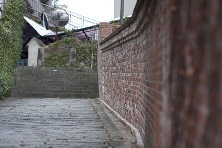 Red brick walls and cobblestoneの写真素材