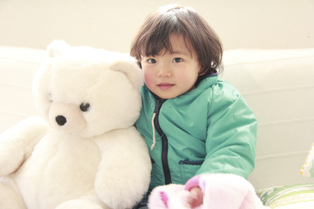 Teddy bear and girlの写真素材