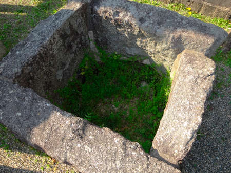 Stone frame of the old well that was buriedの写真素材