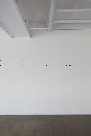 White wall of the construction work before the storeの写真素材