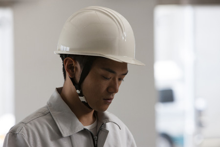Male workers serious lookの写真素材