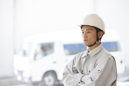 Male workers to his arms foldedの写真素材