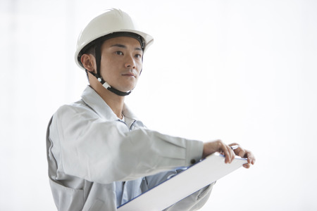 Male workers to check the siteの写真素材