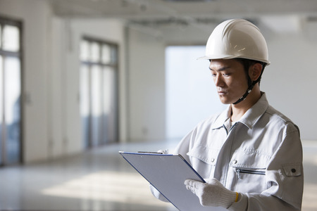 Male workers to check the siteの写真素材