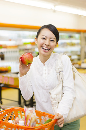Women to shop at the supermarketの写真素材
