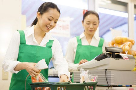 Women clerks stand cashierの写真素材