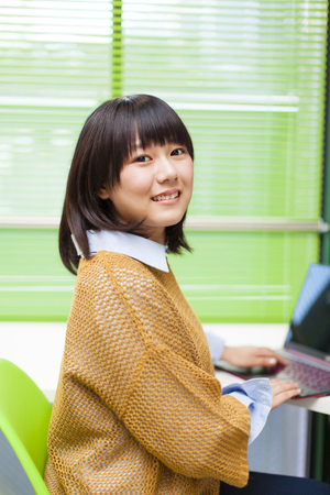 Girl to a personal computerの写真素材