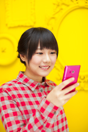 Girls see the Smartphoneの写真素材