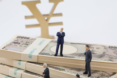 Businessmen discuss money figures