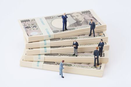 Businessmen discuss money figuresの写真素材
