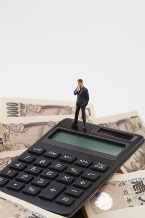 Business people think about money figuresの写真素材