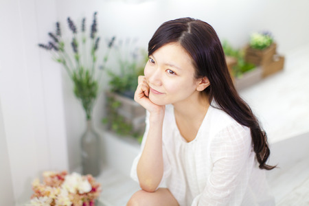 Women lounging in the windowの写真素材