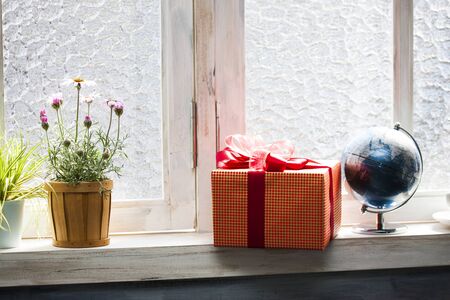 Gift that has been placed on the windowsillの写真素材