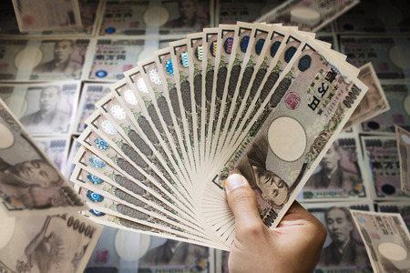 Hand holding the moneyの写真素材