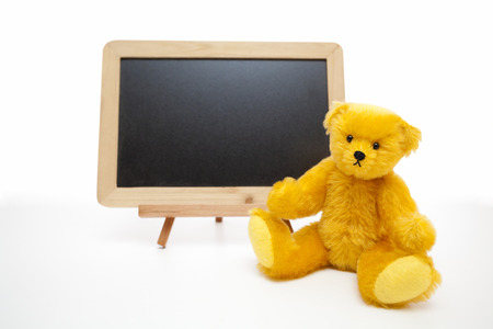 Blackboard and teddy bearの写真素材