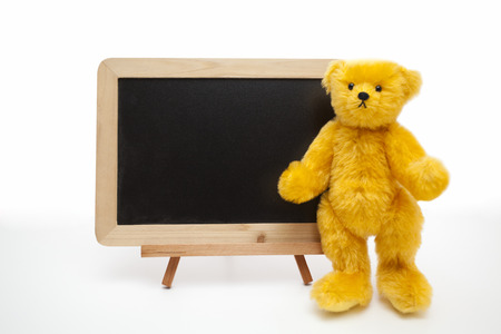 Blackboard and teddy bearの写真素材