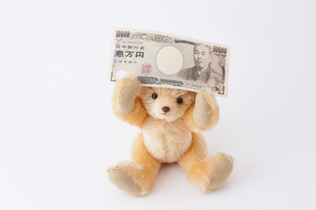Teddy bear with 10000 Yenの写真素材
