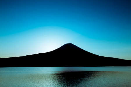 The dawn of Mount Fuji from Lake Tanukiの写真素材
