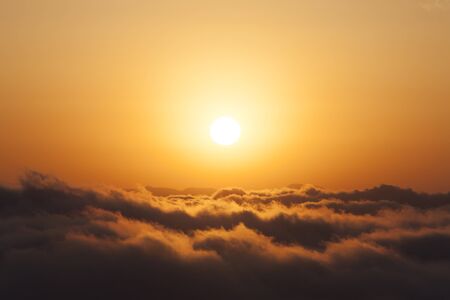 Sunrise over a sea of cloudsの写真素材