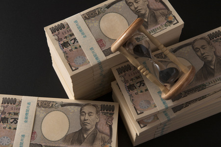 Money and hourglassの写真素材