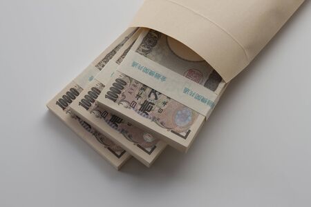money in the brown envelopeの写真素材