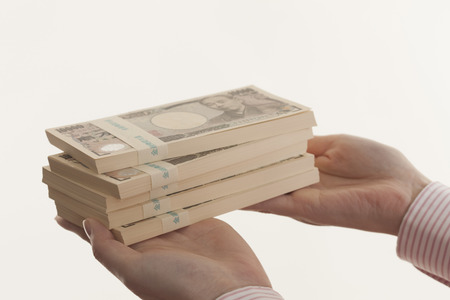 Women with bundle of bills