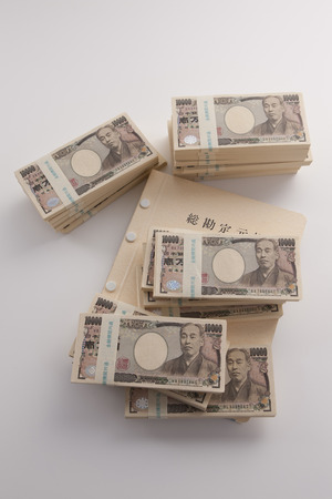 Wad of money and the general ledgerの写真素材