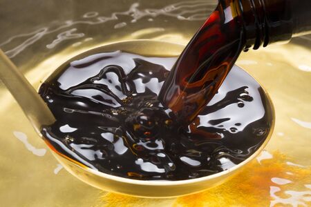 And pour into pan soy sauceの写真素材