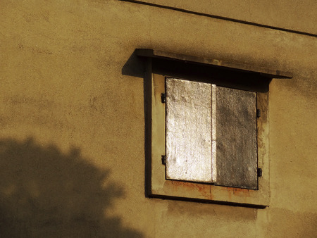 Iron door of the old warehouse of windowの写真素材